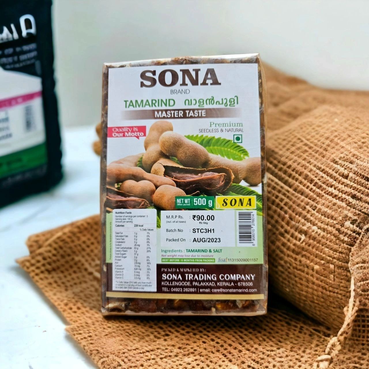 SONA Brand premium seedless tamarind 500 g slab pack resting on a jute sack